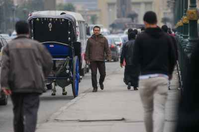 Cairo Hantour and Pedestrians on a Busy Sidewalk