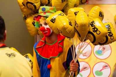 Clown Holding Bingo Branded Yellow Balloons, Cairo Event