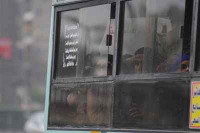 Commuters Inside City Bus on Rainy Cairo Day