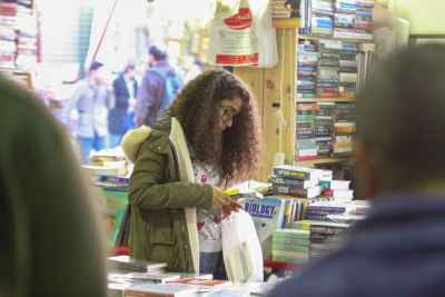 Curly-Haired Girl Reading a Book at Cairo International Book Fair 2017 2