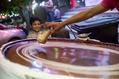 Traditional Kanafany (traditional konafa maker) Preparing Baladi Konafa in Al-Fustat, Egypt
