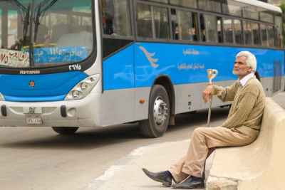 Elderly Man Waiting at Abbassia Bus Stop, Cairo