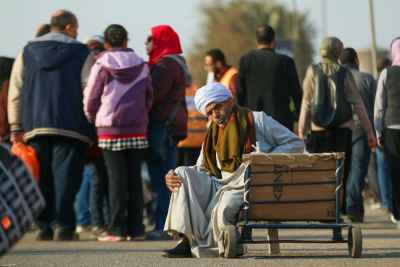 Elderly Porter Resting at Cairo International Book Fair Egypt 3