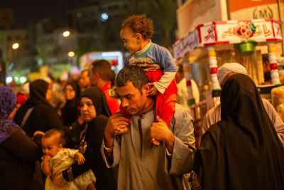 Father Carrying Child at Mulid el Sayyeda Zeinab – Cairo 2017