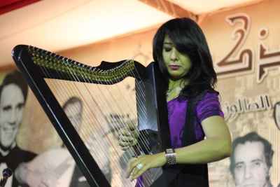 Female Musician Playing the Harp at a Ramadan Tent Event – Egypt 1