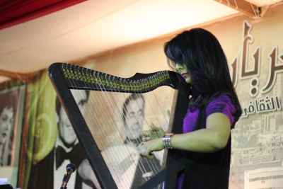 Female Musician Playing the Harp at a Ramadan Tent Event – Egypt 2