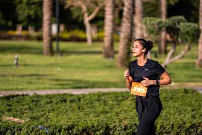 Female Runner Participating in a Marathon Race