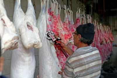Butcher Trimming Hanging Carcasses, Al-Warraq Cairo