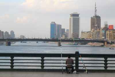 Man Fishing by the Nile — Cairo Bridge View
