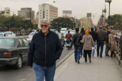 Man Walking on Kasr el Nil Bridge in Cairo