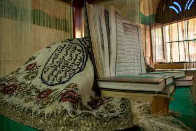 Open Quran on Embroidered Cloth
