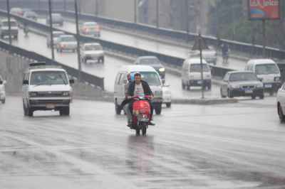 Rainy Cairo Scooter Commute
