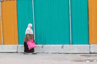 Egyptian Woman Walking Cairo Street Carrying Pink Bag