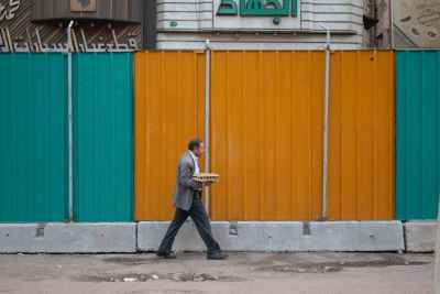 Man Carrying Egg Tray Walking Cairo Street