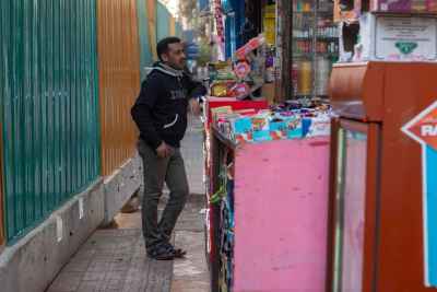 Man Standing by Neighborhood Kiosk, Cairo Street