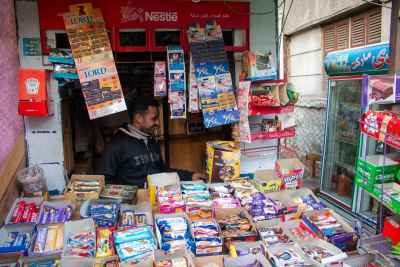 Kiosk Shop Owner Among Snacks and Products, Cairo