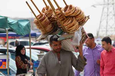 Street Vendor Selling Simit and Dukka Carrying His Basket in Cairo, Egypt 2