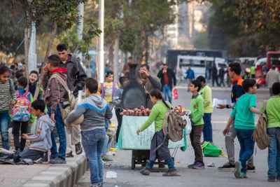 Sweet Potato Cart Vendor Among Schoolchildren, Sudan Street Cairo