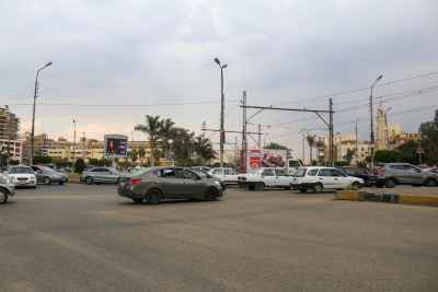 Traffic at a Busy Intersection, Cairo under Cloudy Sky