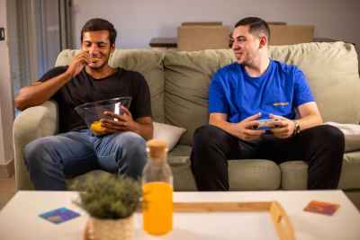 Two friends are enjoying a fun gaming session on PlayStation