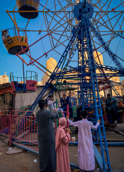 Family Enjoying “Moulid” Swings During Eid in Egypt