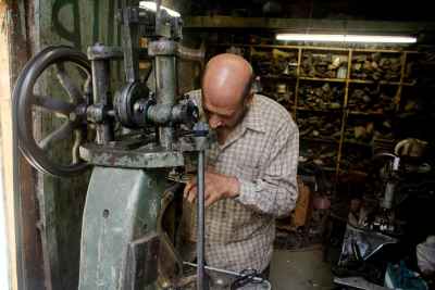 Traditional Gazmagy (shoemaker) Crafting and Repairing Shoes in Bulaq Abul-Ela, Cairo