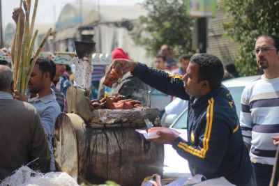 Vendor Selling Sweet Potatoes in Cairo, Egypt