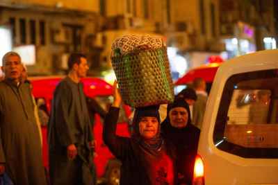 Woman Carrying Basket at Night – Mulid el Sayyeda Zaynab 2017