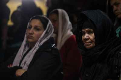 Women Attending a Church Service