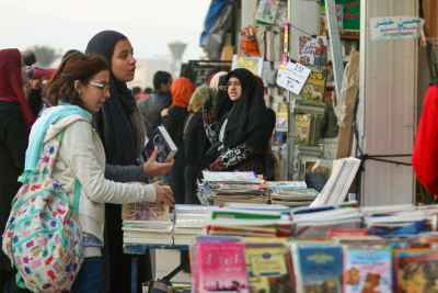 Women Browsing Book Stalls at Cairo International Book Fair 2017