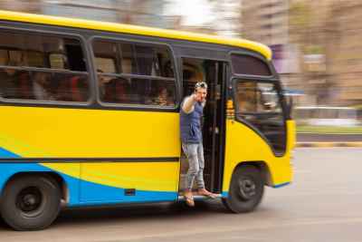 Young Man Hanging from Moving Minibus in Cairo 2