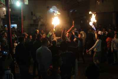 Young Men Performing Fire and Aerosol Spray Dance at Al-Hussein Mawlid – Cairo, Egypt 1