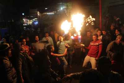 Young Men Performing Fire and Aerosol Spray Dance at Al-Hussein Mawlid – Cairo, Egypt 4