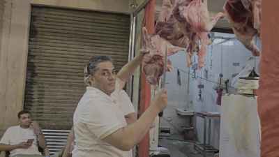 Traditional Butcher Chopping Fresh Sacrificial Meat Before Eid al-Adha