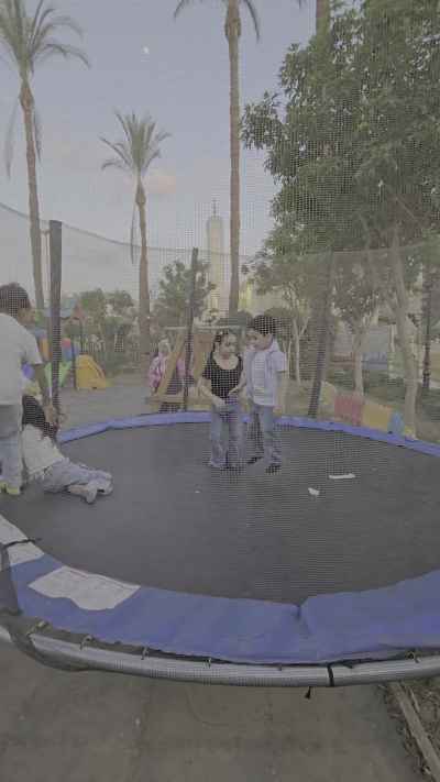 Children Jumping on a Trampoline During Eid Celebration