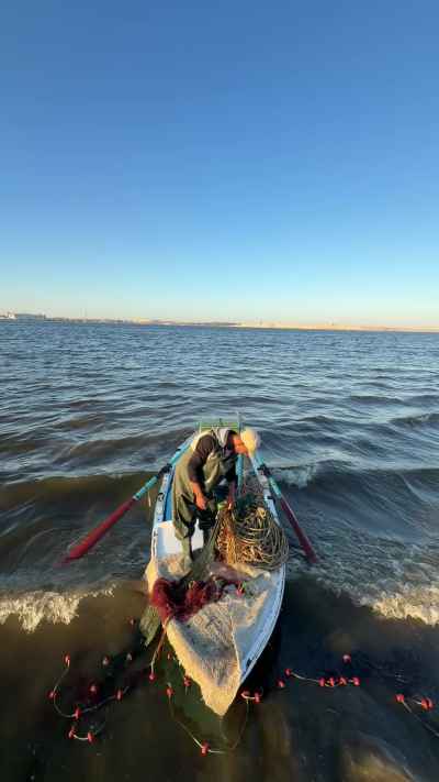 Fisherman with Boat and Net, Al-Nours Beach Ismailia