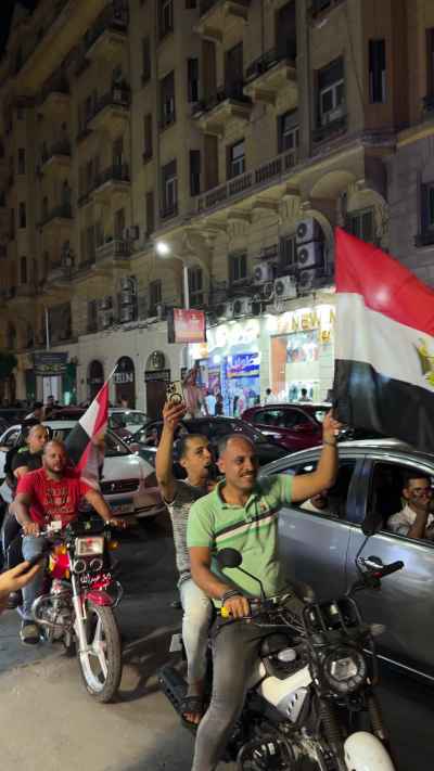 Egyptians Celebrate with Flags at Tahrir Square Night