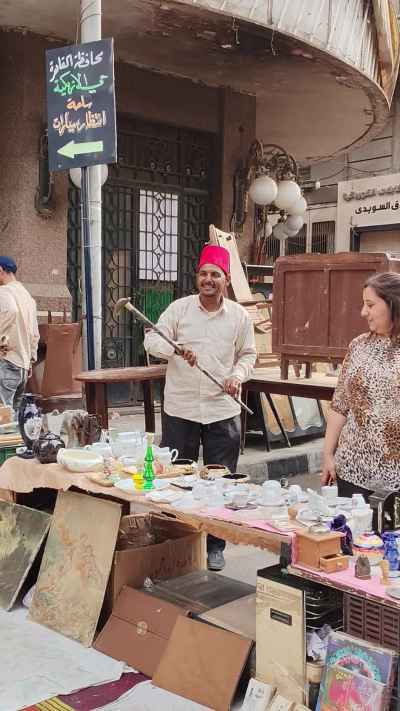 Local Market Vendor Dancing with a Cane and Tarboosh at Diana Market, Cairo