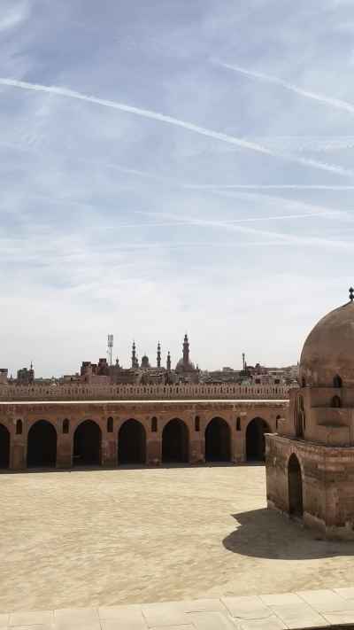 Ibn Tulun Mosque Courtyard with Cairo Skyline