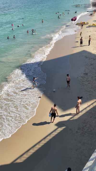 People Playing Football on Alexandria Beach, Egypt