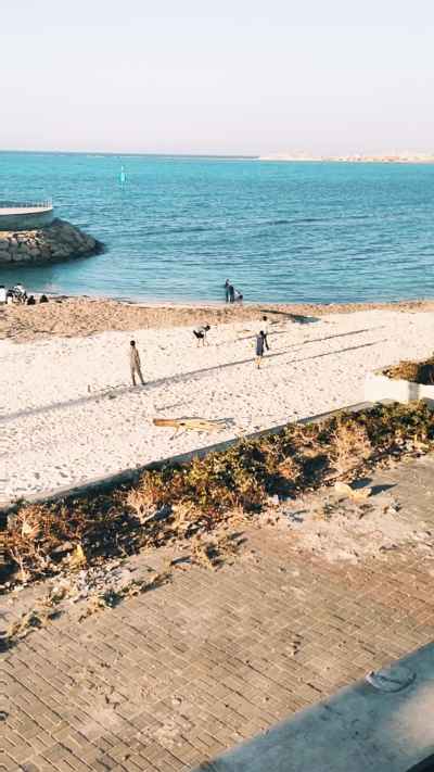 Father and Children Playing Football on Marsa Matruh Beach