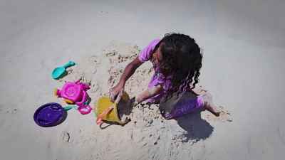 Girl Playing with Sand Toys