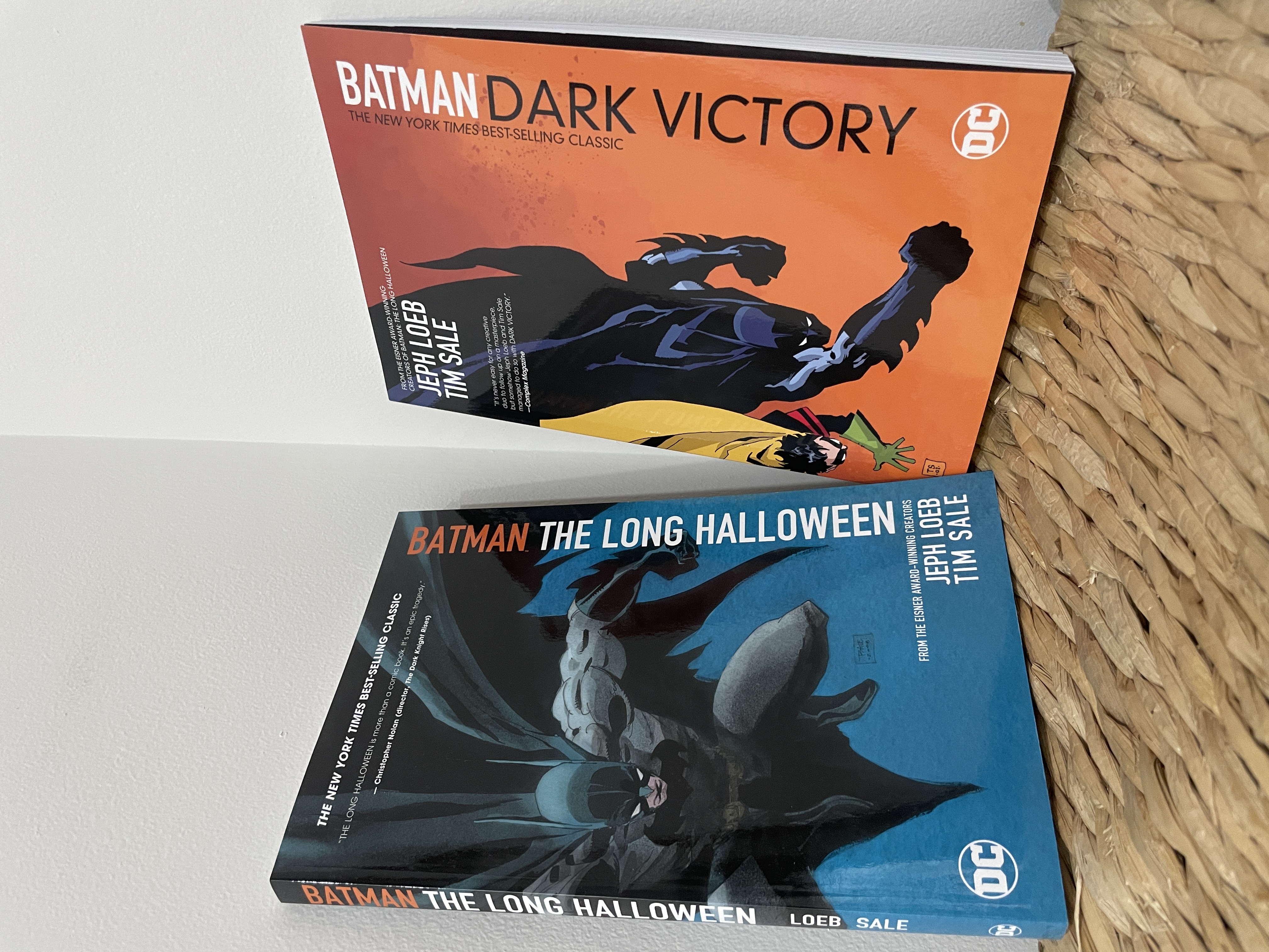Two comic books of the Batman: The Long Halloween and Batman: The Dark Victory.
