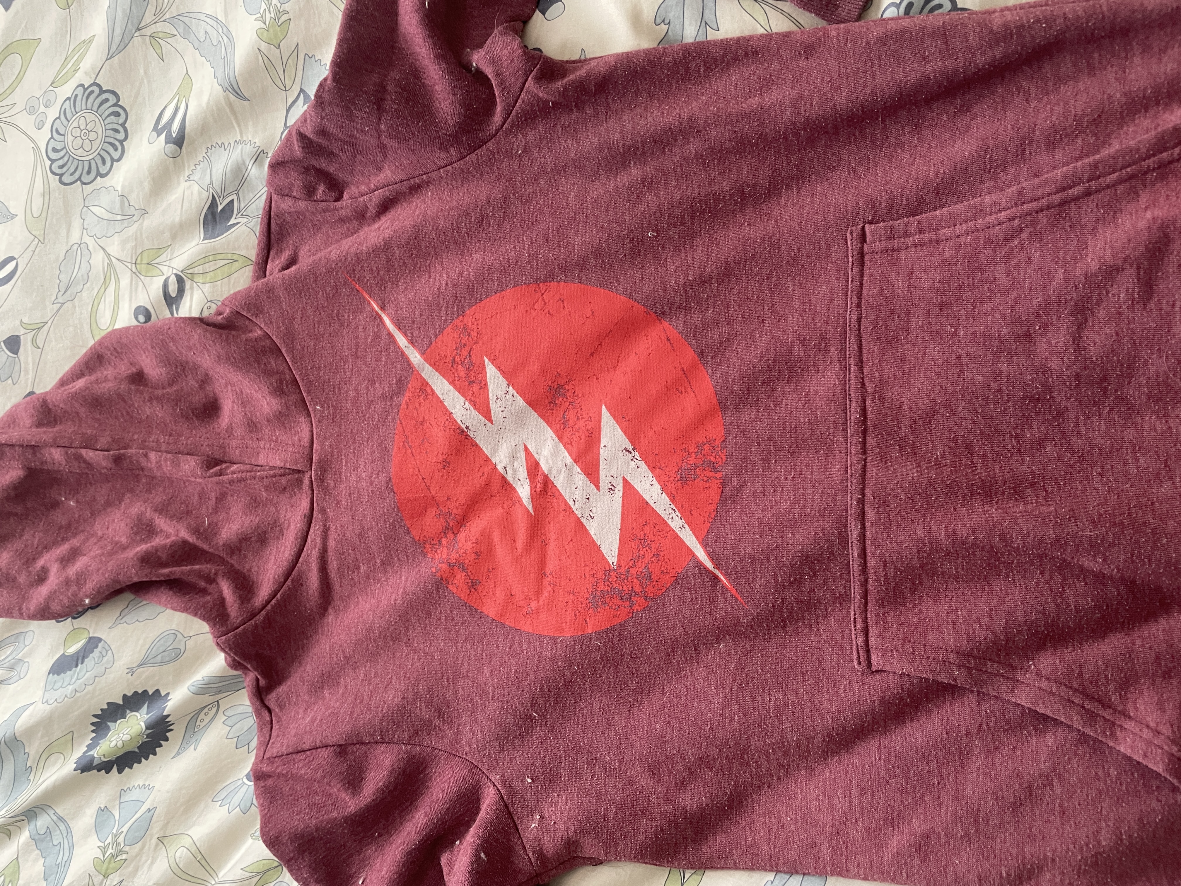 The Flash symbol on a red jumper.