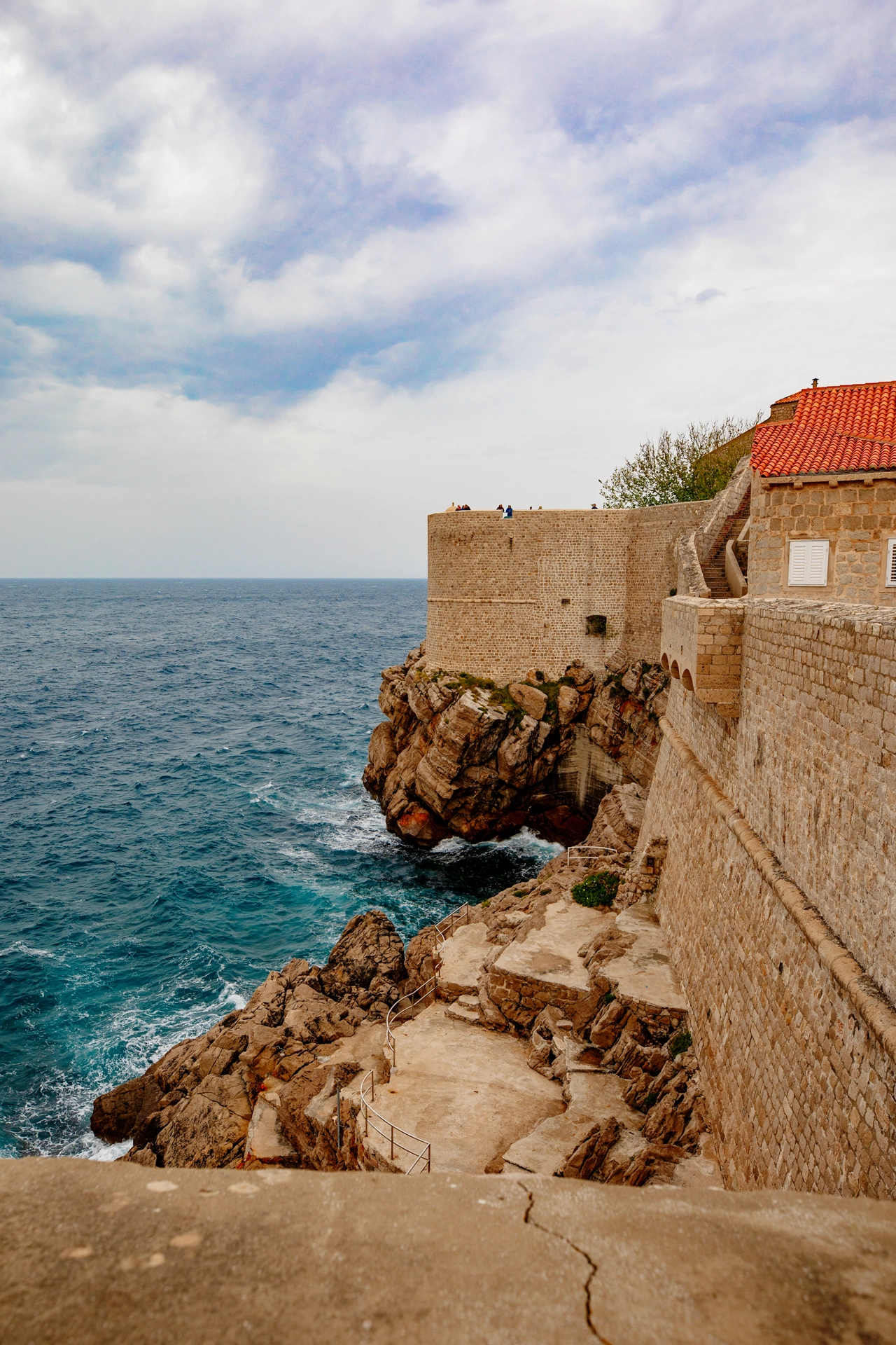 Dramatic Cliffside Walls of Dubrovnik Overlooking the Adriatic