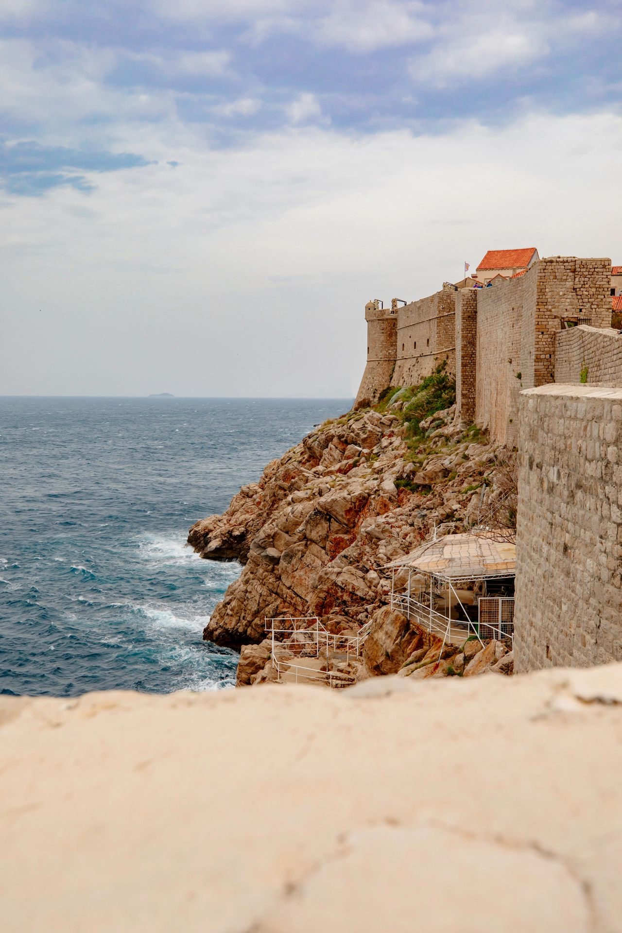 Dramatic Cliffside Walls of Dubrovnik Overlooking the Adriatic