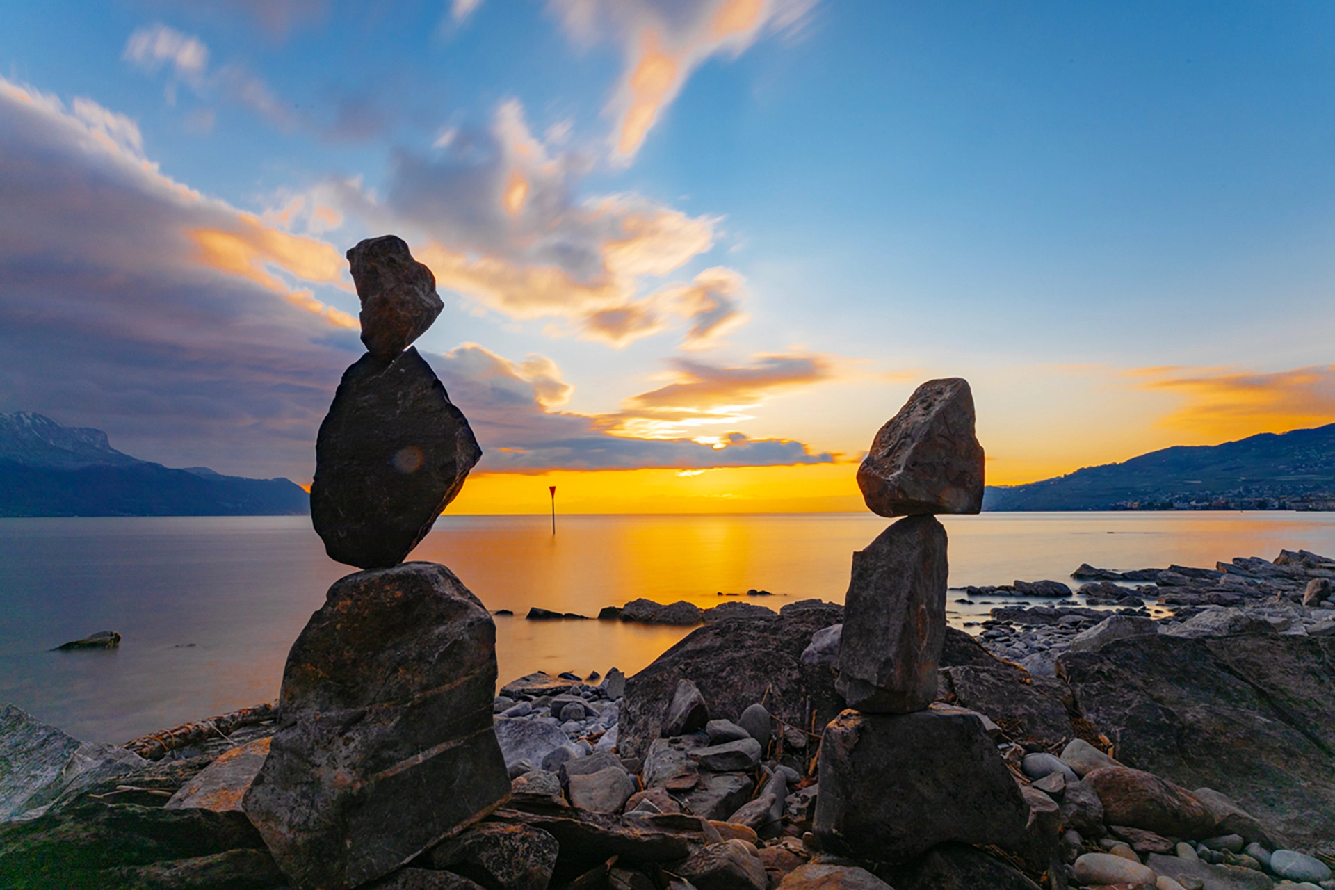 Balanced Stones at Sunset on Lake Geneva’s Shore