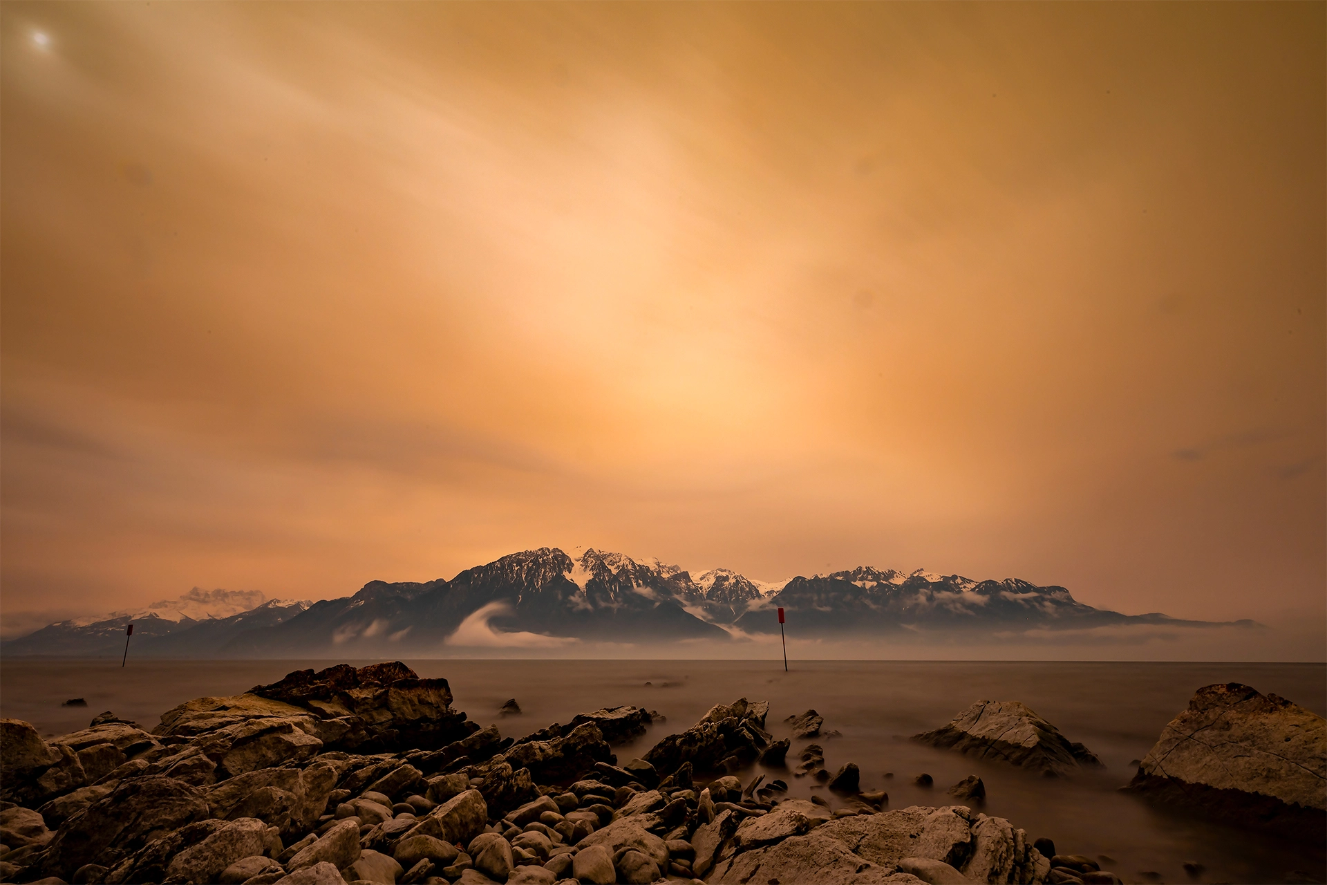 Golden Haze: Sahara Dust Over Lake Léman