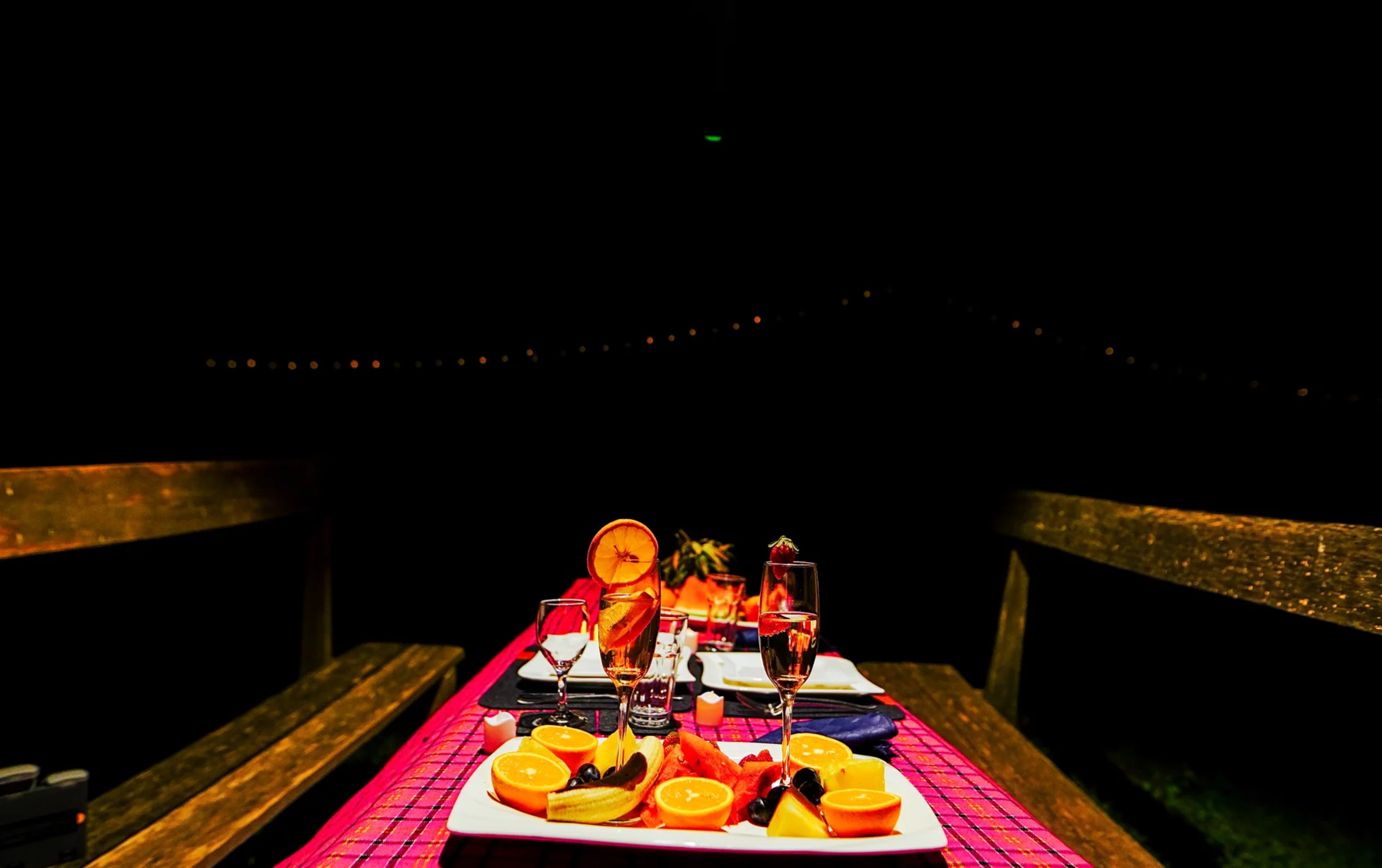 Bush dinner setup under lantern light