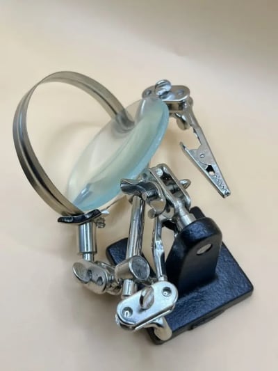 Magnifier stand with three handles